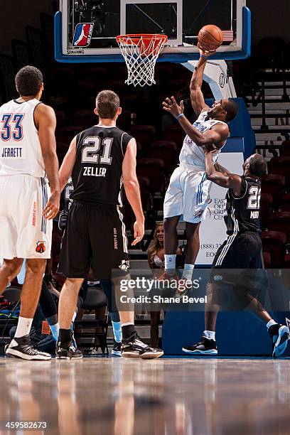 Isaiah Wilkerson of the Tulsa 66ers shoots against Ronald Murray during the NBA D-League game on December 27, 2013 at the Spirit Bank Event Center in...