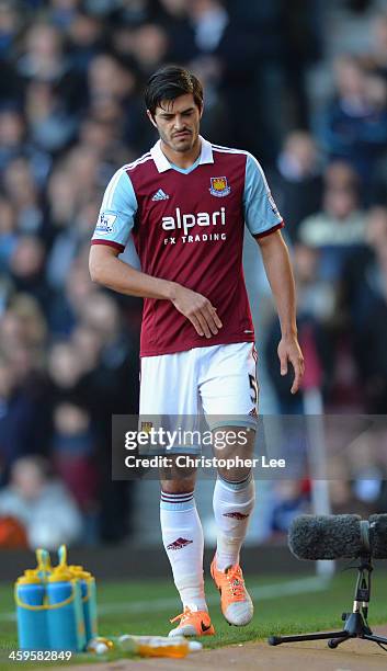 James Tomkins of west Ham looks dejected as he leaves the field with an injury during the Barclays Premier League match between West Ham United and...