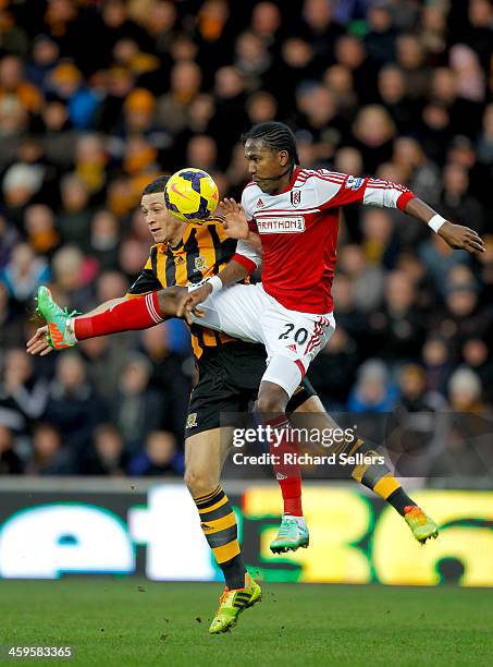 James Chester of Hull City challenges Hugo Rodellega of Fulham during the Barclays Premier League match between Hull City and Fulham at KC stadium on...