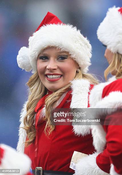 Member of the Buffalo Bills cheerleaders the Buffalo Jills wears a Santa Claus outfit during NFL game action against the Miami Dolphins at Ralph...