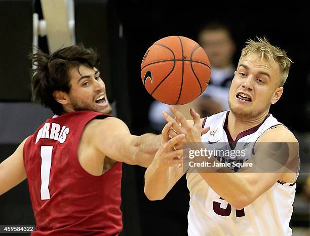 Jonathan Gilling of the Arizona State Sun Devils and Riley Norris of the Alabama Crimson Tide battle for a rebound during the CBE Hall Of Fame...