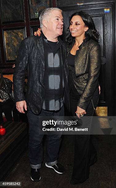 Tim Blanks and Jacqui Soliman attend the launch of the Rockins For Eyeko collection at The Scotch of St James on November 25, 2014 in London, England.