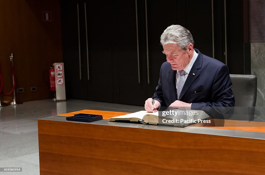 German President Joachim Gauck signs Golden book of guest in...