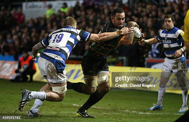 Samu Manoa of Northampton breaks away to score a try during the Aviva Premiership match between Northampton Saints and Bath at Franklin's Gardens on...