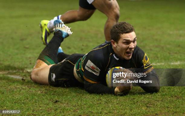 George North of Northampton dives over for the final try during the Aviva Premiership match between Northampton Saints and Bath at Franklin's Gardens...