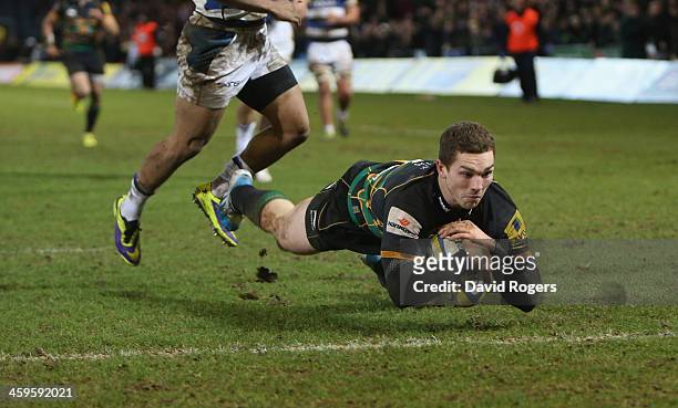 George North of Northampton dives over for the final try during the Aviva Premiership match between Northampton Saints and Bath at Franklin's Gardens...