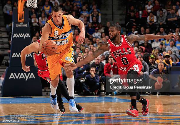 Danilo Gallinari of the Denver Nuggets controls the ball and heads down court against Aaron Brooks of the Chicago Bulls at Pepsi Center on November...