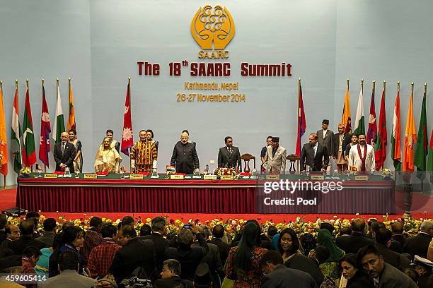 Leaders stand during the inaugural session of the 18th SAARC Summit on November 26, 2014 in Kathmandu, Nepal. Nepal is hosting the 18th South Asian...