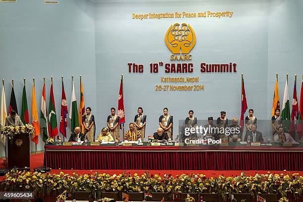 Sushil Koirala, Prime Minister of Nepal, gives a speech while other SAARC leaders sit during the inaugural session of the 18th SAARC Summit on...