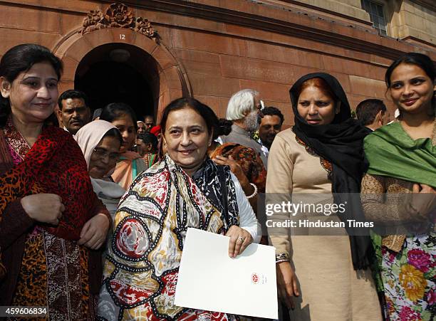 Tazeen Fatima , wife of Uttar Pradesh Minority Affairs Minister Azam Khan, with family members after taking oath as Rajya Sabha MP at Parliament...