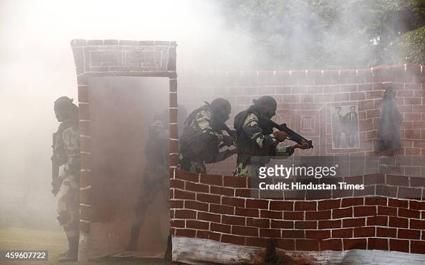 Jawans present a drill during the BSFs Golden Jubilee Celebrations on November 2014 in New Delhi, India. The Border Security Force was raised...
