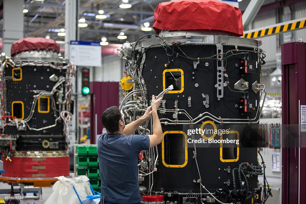 Br275 Engine An employee holds cables as he works on a Rolls-Royce BR725 aircraft ...