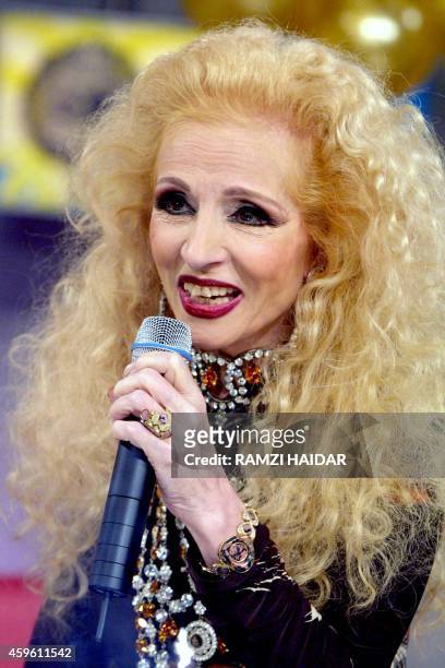 Lebanese singer Sabah performs during the taping of an entertainment program at the studios of Future TV satellite station in Beirut 17 January 2002....