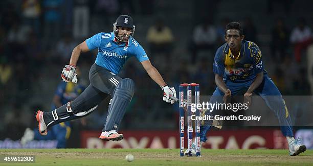 Ravi Bopara of England makes his ground underpressure from Ajantha Mendis of Sri Lanka during the 1st One Day International between Sri Lanka and...