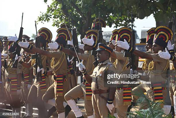 Police personnel salute during a service at the memorial for police and uniformed personnel who lost their lives in the 2008 terror attacks on...