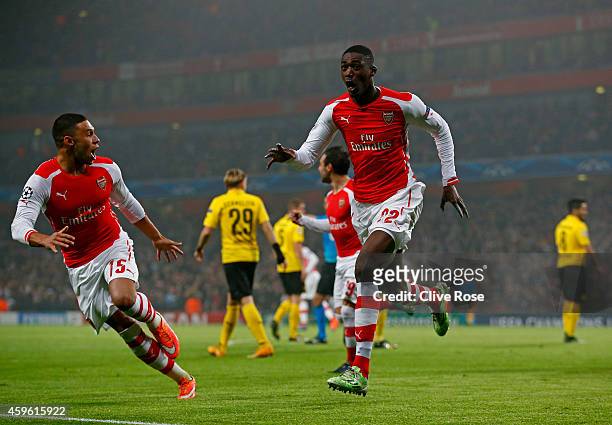 Yaya Sanogo of Arsenal celebrates after scoring the opening goal during the UEFA Champions League Group D match between Arsenal and Borussia Dortmund...