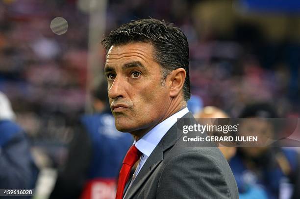 Olympiakos' Spanish coach Michel looks on before the UEFA Champions League Group A football match Club Atletico de Madrid vs Olympiakos FC at the...