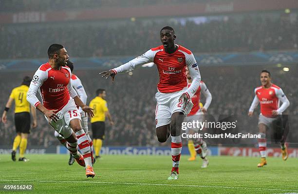 Yaya Sanogo celebrates scoring the Arsenal goal with ALex Oxlade-Chamberlain during the UEFA Champions League match between Arsenal and Borussia...