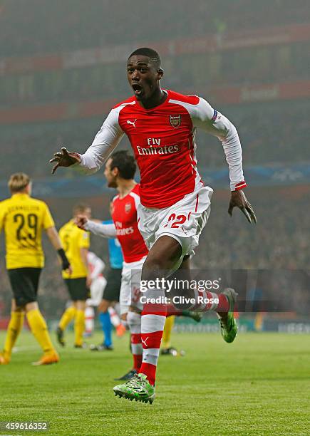 Yaya Sanogo of Arsenal celebrates after scoring the opening goal during the UEFA Champions League Group D match between Arsenal and Borussia Dortmund...