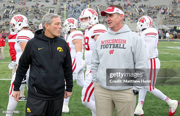 Head coach Gary Andersen of the Wisconsin Badgers talks with head coach Kirk Ferentz of the Iowa Hawkeyes, before their match-up on November 17, 2014...
