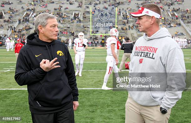 Head coach Gary Andersen of the Wisconsin Badgers talks with head coach Kirk Ferentz of the Iowa Hawkeyes, before their match-up on November 17, 2014...