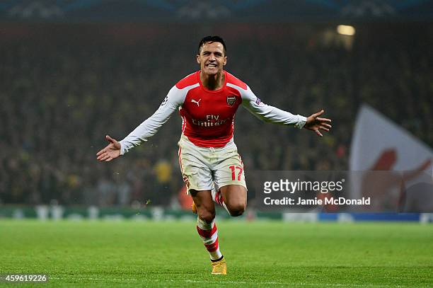 Alexis Sanchez of Arsenal celebrates after scoring his team's second goal during the UEFA Champions League Group D match between Arsenal and Borussia...