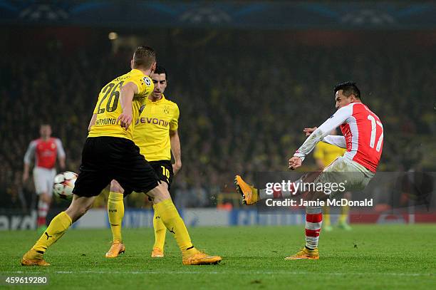 Alexis Sanchez of Arsenal scores his team's second goal during the UEFA Champions League Group D match between Arsenal and Borussia Dortmund at the...
