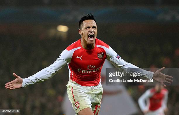 Alexis Sanchez of Arsenal celebrates after scoring his team's second goal during the UEFA Champions League Group D match between Arsenal and Borussia...