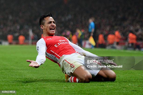 Alexis Sanchez of Arsenal celebrates after scoring his team's second goal during the UEFA Champions League Group D match between Arsenal and Borussia...