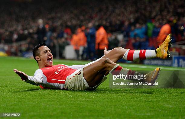 Alexis Sanchez of Arsenal celebrates after scoring his team's second goal during the UEFA Champions League Group D match between Arsenal and Borussia...