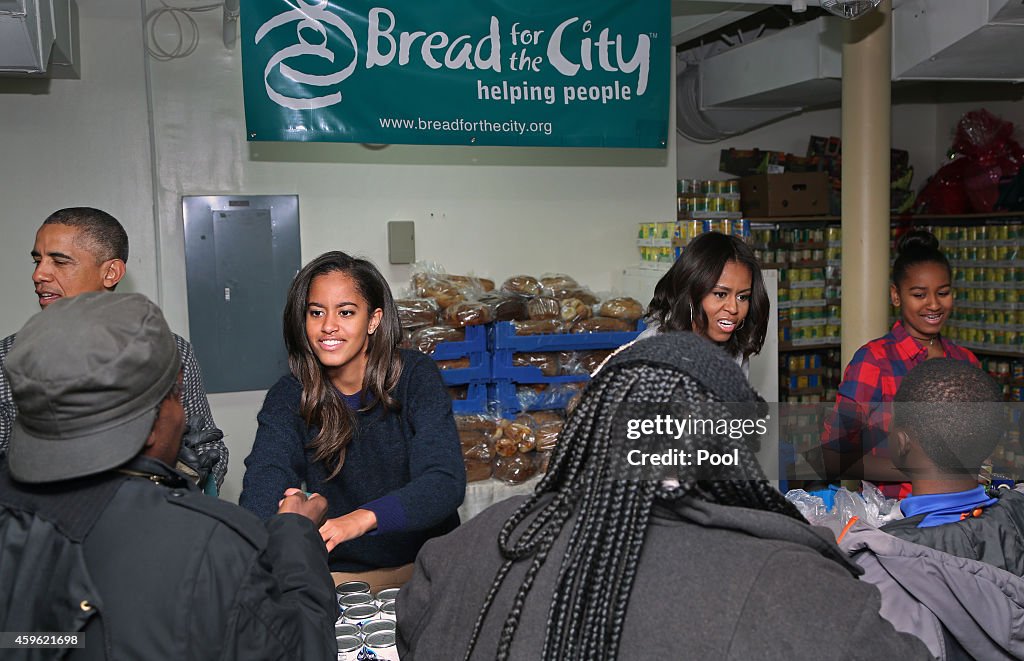 Obama Distributes Food At Bread For The City