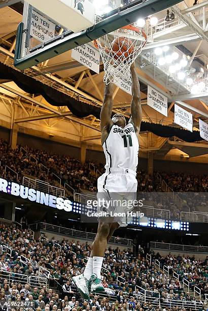 Keith Appling of the Michigan State Spartans drives the ball to the basket during the first half of the game against the New Orleans Privateers at...
