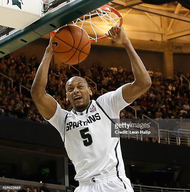 Adreian Payne of the Michigan State Spartans drives the ball to the basket during the second half of the game against the New Orleans Privateers at...