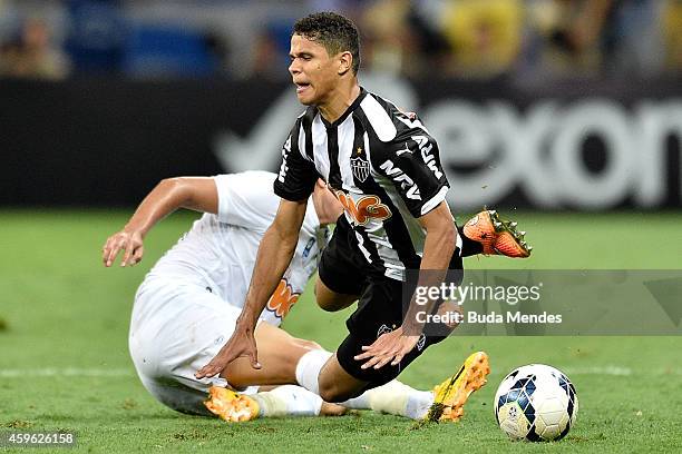 Douglas Santos of Atletico MG struggles for the ball with a Marcelo Moreno of Cruzeiro during a match between Atletico MG and Cruzeiro as part of...