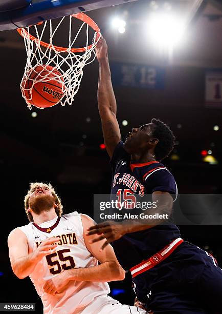 Sir'Dominic Pointer of the St. John's Red Storm dunks over Elliott Eliason of the Minnesota Golden Gophers in the second half at Madison Square...