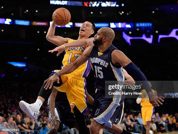 Jeremy Lin of the Los Angeles Lakers is fouled driving to the basket by Vince Carter of the Memphis Grizzlies during the first half at Staples Center...