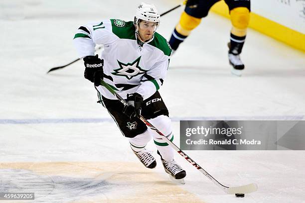 Dustin Jeffrey of the Dallas Stars skates with the puck during a NHL game against the Nashville Predators at Bridgestone Arena on December 12, 2013...