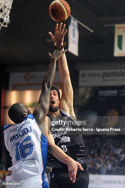 Gino Cuccarolo of Granarolo competes with Cheikh Mbodj of Acqua Vitasnella looks over during the LegaBasket Serie A1 match between Acqua Vitasnella...