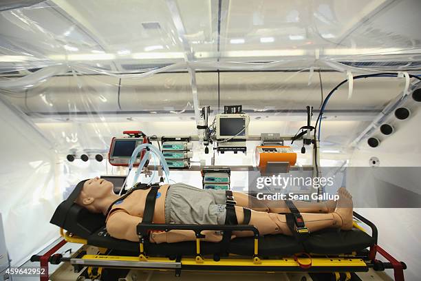 Mannequin lies in the isolation unit of a retrofitted Lufthansa plane equipped with medical facilities for Ebola cases during a media presentation at...