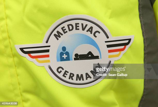 The logo of the German MedEvac crew is seen on the jacket of a volunteer and crew member from the Robert Koch Institute in the isolation unit of a...