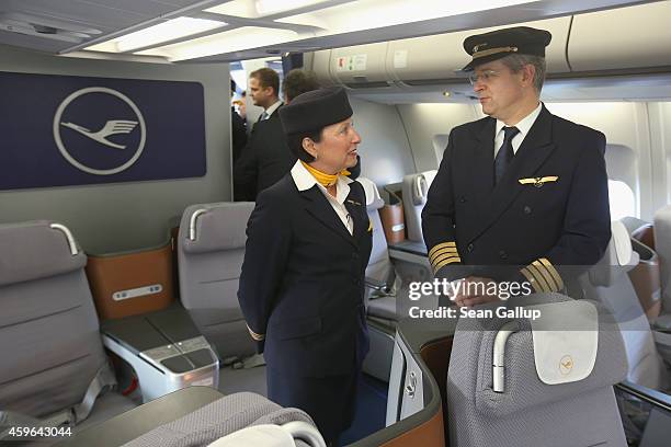 Volunteers of German airliner Lufthansa stand inside a retrofitted Lufthansa plane equipped with medical isolation facilities for Ebola cases during...