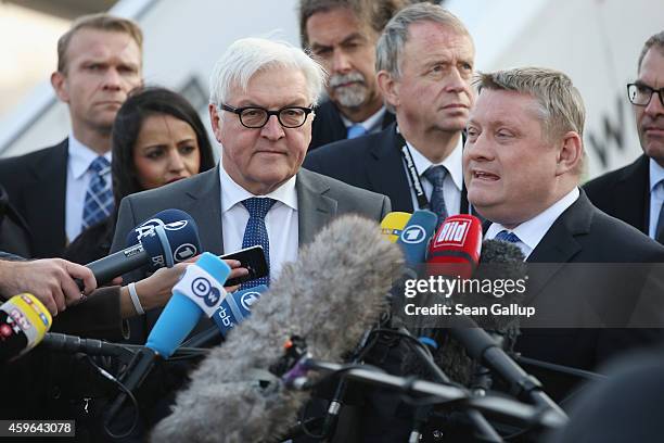 German Foreign Minister Frank-Walter Steinmeier and Health Minister Hermann Groehe speak to the media after viewing a retrofitted Lufthansa plane...