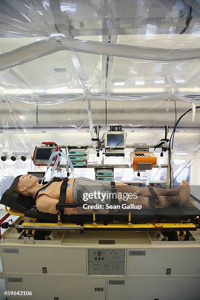 Mannequin lies in the isolation unit of a retrofitted Lufthansa plane equipped with medical facilities for Ebola cases during a media presentation at...