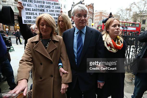 Andrew Mitchell , his wife Dr Sharon Bennett and other family members arrive at the High Court on November 27, 2014 in London, England. A verdict is...