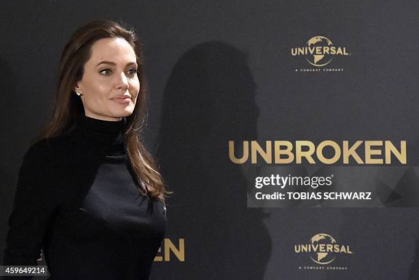 Actress and director Angelina Jolie leaves after a photocall for her film "Unbroken" on November 27, 2014 in Berlin. The film by US actress and...