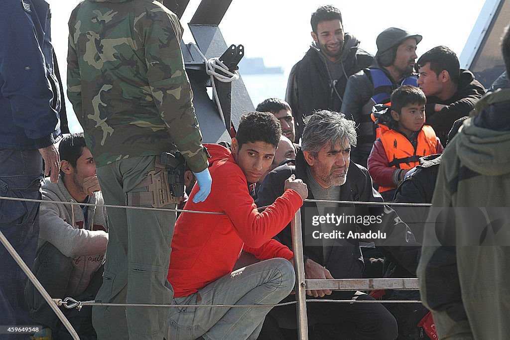 Migrants are taken to Athens' Ierapetra Sports Hall