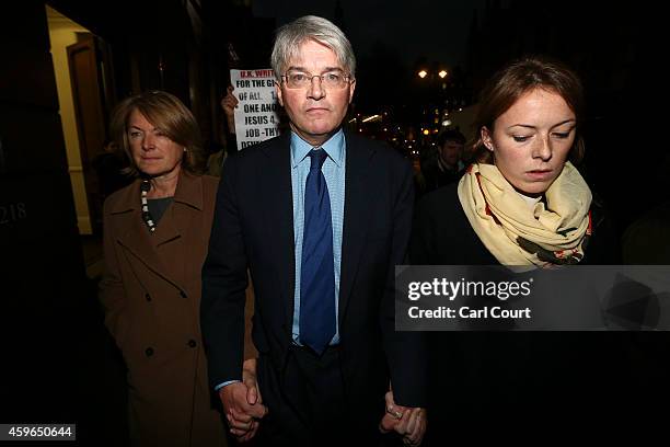 Andrew Mitchell , his wife Dr Sharon Bennett and a woman believed to be his daughter leave the High Court on November 27, 2014 in London, England. A...