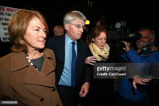 Andrew Mitchell , his wife Dr Sharon Bennett and a woman believed to be his daughter leave the High Court on November 27, 2014 in London, England. A...