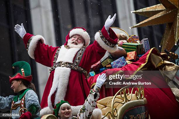 Santa Claus waves to the crowd during the Macy's Thanksgiving Day Parade on November 27, 2014 in New York City. The annual tradition marks the start...
