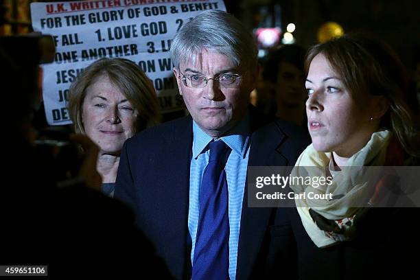 Andrew Mitchell , his wife Dr Sharon Bennett and a woman believed to be his daughter leave the High Court on November 27, 2014 in London, England. A...